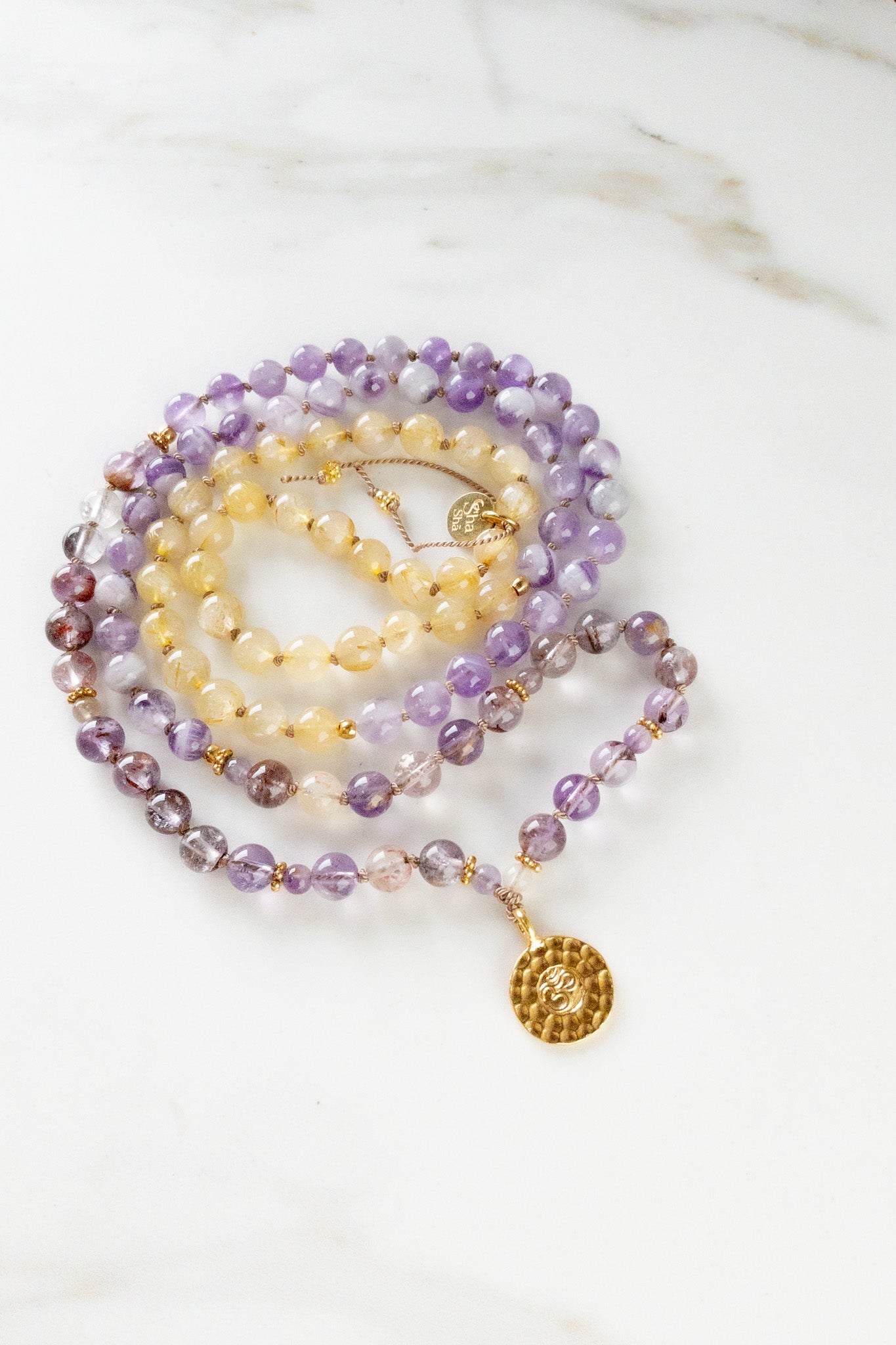 OM Vibrations Mala - Indradhanush - super7 - golden rutile quartz - amethyst lace - ShaSha Yoga meditation jewellery - handmade in switzerland