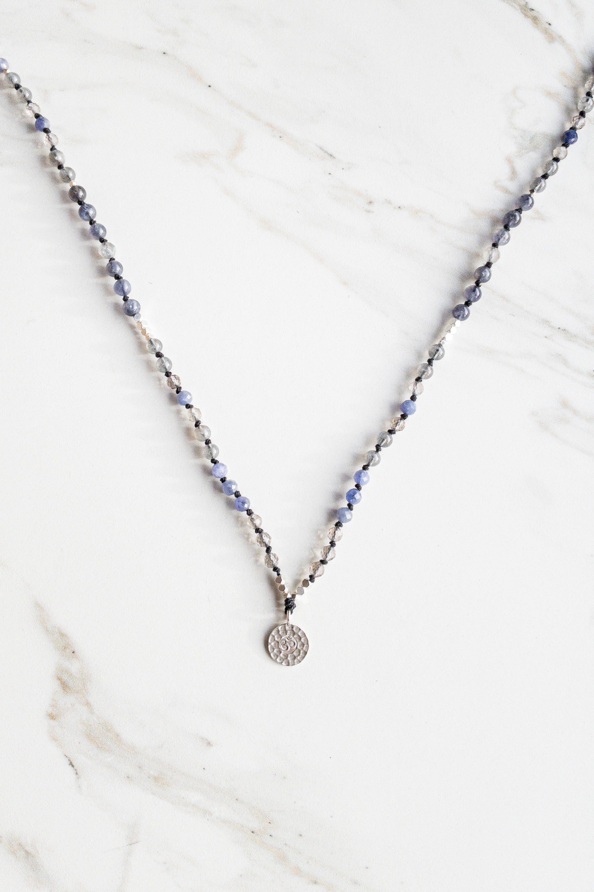 “Lunar Radiance in Abysses” OM Mala necklace - Indradhanush - tanzanite - shashā yoga jewellery Switzerland 